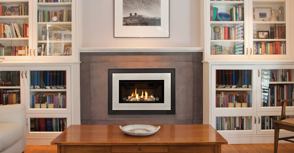 Fireplace nestled between a home library