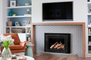 Valor G3.5 Gas Fireplace Insert featuring black trim with a TV mounted above
