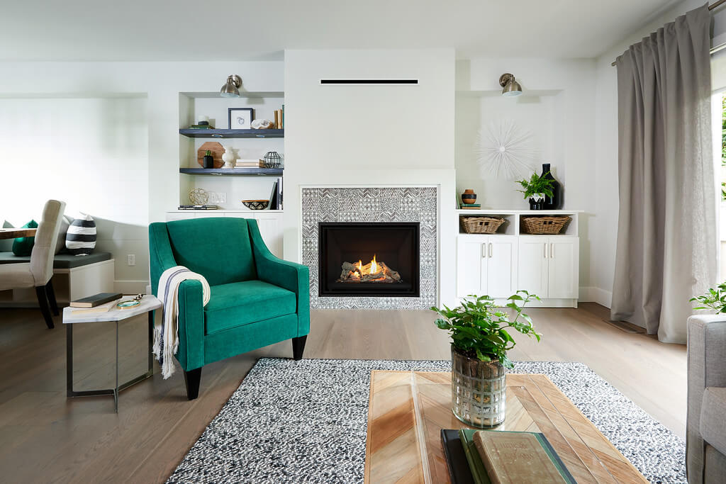 Black and white tiles surround fireplace on a white wall